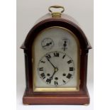 An early 20th Century domed eight day mantle clock, silvered face Westminster chime brass, carry