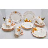 A collection of Shelley tea cups and saucers, cake plate, in the Patches pattern, one box to