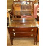 An Edwardian mahogany mirror backed dressing table, an Edwardian mahogany two door side cupboard and