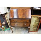 An early 20th Century mahogany bureau, the fall front enclosing a fitted interior, drawers below,