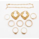 A collection of 9ct gold jewellery to include seven ring, including opal and paste set versions,