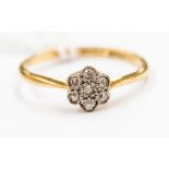An Edwardian diamond set flower 18ct gold cluster ring, setting approx 5mm, size M1/2, total gross