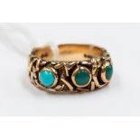 A 9ct gold and turquoise ring, ornate gold decoration with three rub over set turquoise, size P,
