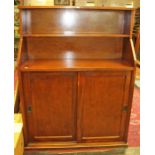 A 20th Century mahogany chiffonier, the upper section with two shelves, the base fitted with two