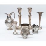 A collection of silver and plate to include: a pair of modern baluster silver candlesticks,