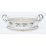 A substantial WMF silver plated flower dish, twin handled standing on four ball feet with four