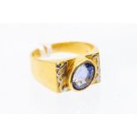 A  sapphire and 22 carat gold dress ring, the oval cut sapphire measuring approx 9.5 x 7.3x 6.5