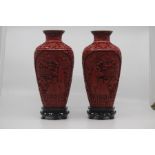 A pair of Chinese cinnabar lacquer vases, 20th Century, of tapering shouldered form with everted