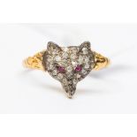 A diamond set silver and 18ct gold fox ring, the head pave set with diamonds and red spinel set