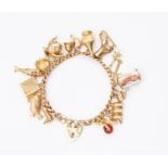A 9ct gold curb link bracelet with eighteen charms to include a parrot, ice skate, three monkeys (