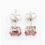 A pair of tourmaline and silver studs, comprising oval cut tourmaline approx. 6 x 4mm, claw settings