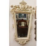 A Victorian Renaissance Revival carved and Gesso edged wall mirror moulded edges, the crest with the