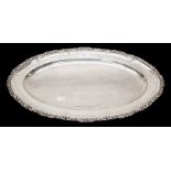 A Continental 800 standard silver serving plate, oval form with scroll and foliate border, size