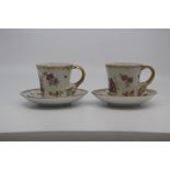 A pair of Carl Thieme porcelain 'hausmaler' decorated coffee cups and saucers, second half 19th