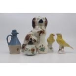 A group of decorative ceramics to include: a Staffordshire seated dog, 20cm; a pair of porcelain