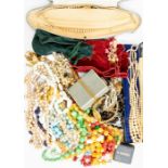 A collection of costume jewellery, including white and yellow metal items, boxed pearls, beads,