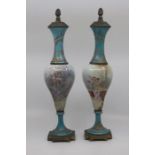 A pair of Sevres style metal mounted vases, late 19th Century, of slender baluster form and