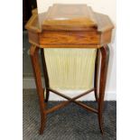 An early 19th Century rosewood and satinwood banded ladies work table, circa 1810, the hinged top