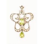 An Edwardian peridot, pearl and diamond pendant, set with an oval peridot to the centre, within a