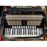 A cased Hohner Polyphonic 400 accordion, complete within travelling case.