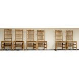 A set of six traditional solid beech spindle back chairs, fitted with drop in rush seats, raised