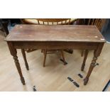 An oak 20th Century Windsor chair on turned legs, high backed saddle seat with a pine hall table