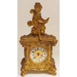 A French gilt metal desk clock, having a cherub mounted to top, white enamelled dial with Arabic