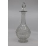 An engraved glass decanter and stopper, of pear form and decorated with a running stag amid trees