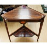 An early 19th Century mahogany fold-over tea table, raised on turned supports, 73cm high, 92cm wide,