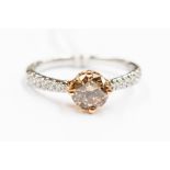 A diamond and 18ct gold ring comprising a brilliant cut cinnamon diamond of approx. over 1 carat,
