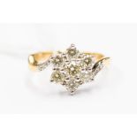 A diamond and 18ct gold flower cluster of approx 0.80ct, cross over shoulders set to the tips with