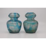 A pair of Austrian iridescent glass vases, circa 1910, of gourd form, 11cm high. (2)