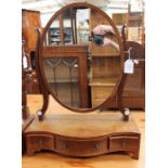 An early Victorian mahogany dressing table mirror, fitted with three drawers raised on turned