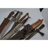 Six decorative Swords, one Machete in scabbard and a Spear (8)