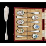 A set of six George V silver-gilt and enamel teaspoons, white guilloche enamel, each reverse bowl