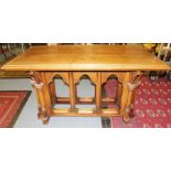 A 20th Century Gothic Revival style oak altar table, Gothic arch underside, measuring 85cm high,