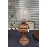 Victorian spelter metal oil lamp with etched glass shade, cracking to reservoir.