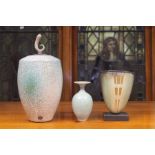 A Tim Andrews raku glazed vase and cover, of ovoid shouldered form, the cover with scroll finial,