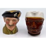 A Royal Doulton Monty character jug, along with another of an Indian man