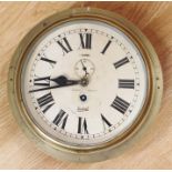 An early 20th Century brass ships clock, brass case, Roman numerals, London maker, slight damage