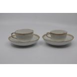 A pair of Berlin porcelain coffee cups and saucers, circa 1890, of rounded form and finely moulded