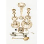 A collection of silver including three various capstan inkwells, a pair of candlesticks, a filled