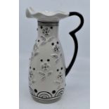 Lorna Bailey- A Lorna Bailey jug by Shorter, white with black floral details. Height approx 22.