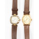 Longines: A vintage gold plated Ladies wrist watch, quartz oval dial (2cm long), black numbers,
