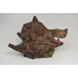 A Continental cold painted boars head inkwell with detachable inset inkwell and a pair of branch