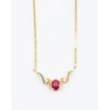 A ruby and diamond 14k gold neck-let set with an oval cabochon ruby, approx. 5 x 3mm, two claw set