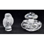 A Baccarat perfume glass bottle in the shape of a flower along with a modern Lalique owl