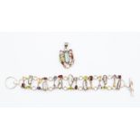 A silver and stone set bracelet comprising blister set pearls, amethyst, iolite, garnet and