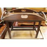A mahogany butlers table, probably early 20th Century, with folding flaps