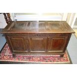 An early 18th Century joined oak chest, fitted with raised and fielded panels, the lid opening to